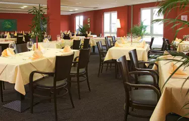 Room with covered tables and seating